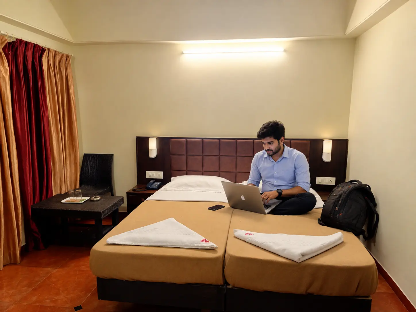 Compact room with two beds at Hotel Viva Baga in Goa